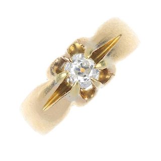 An early 20th century 18ct gold diamond single-stone ring. The old-cut diamond, to the scalloped sid