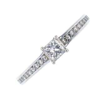 An 18ct gold diamond single-stone ring. The square-shape diamond, with graduated brilliant-cut diamo