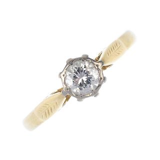An 18ct gold diamond single-stone ring. The brilliant-cut diamond, within an illusion-setting, to th