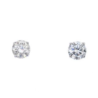 A pair of brilliant-cut diamond ear studs. Estimated total diamond weight 1.40cts, I-J colour, P1 cl