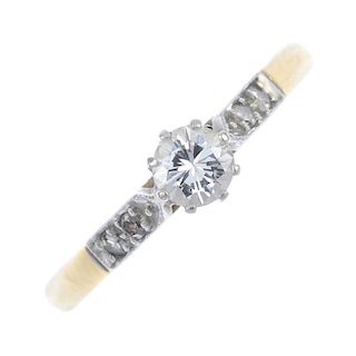 A diamond single-stone ring. The brilliant-cut diamond, with single-cut diamond accent sides, to the