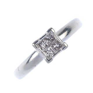 A platinum diamond dress ring. The square-shape diamond panel, to the plain band. Total diamond weig