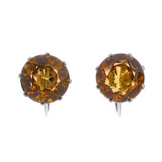 A pair of citrine ear studs. Each designed as a circular-shape citrine, to the screw back fitting. L