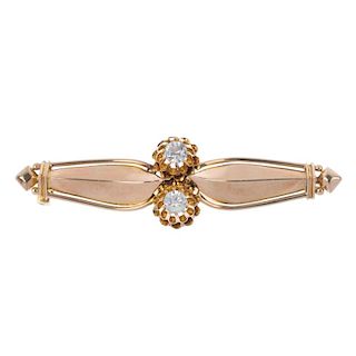A mid 20th century zircon brooch. The twin circular-shape colourless zircon line, to the stylised fo