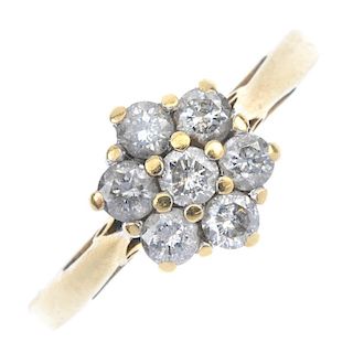 An 18ct gold diamond floral cluster ring. The brilliant-cut diamond, within a similarly-cut diamond