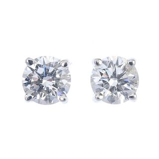 A pair of 18ct gold brilliant-cut diamond ear studs. Accompanied by report numbers 6127367965 and 61