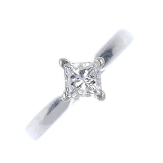 A platinum diamond single-stone ring. The square-shape diamond, weighing 0.60ct, to the tapered shou