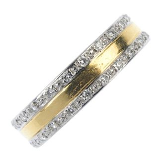 An 18ct gold diamond full-circle eternity ring. Of bi-colour design, the plain band, with brilliant-