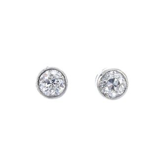 A pair of old-cut diamond collet ear studs. Estimated total diamond weight 0.30ct, H-I colour, VS cl
