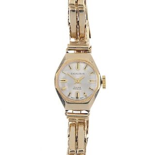 A lady's mid 20th century 9ct gold wristwatch. The silvered and textured dial, reading Excalibur, wi