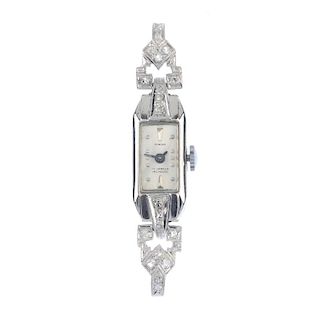 A lady's mid 20th century diamond manual wind cocktail watch head. The rectangular-shape white dial