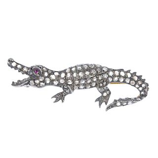 An early 20th century silver and gold ruby and diamond alligator brooch. Designed as a rose-cut diam