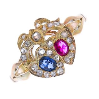 A ruby, sapphire and diamond dress ring. The oval shaped sapphire and ruby, each within a rose-cut h