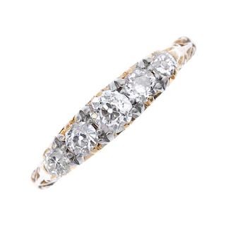 A mid 20th century 18ct gold diamond five-stone ring. The graduated circular-cut diamond line, to th