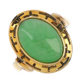 A jade ring and a pair of jade ear pendants. The ring designed as an oval jadeite cabochon, within a