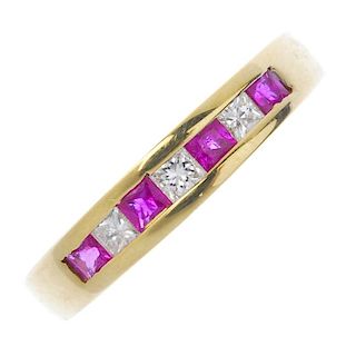 An 18ct gold ruby and diamond half-circle eternity ring. The alternating square-shape ruby and diamo