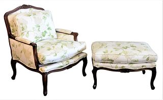 Louis XV Style Fauteuil and Ottoman, each having floral upholstery and carved frames, height 38 inches, width 32 inches.
