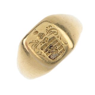 A gentleman's early 20th century gold intaglio signet ring. Depicting a swan over a shield, with scr