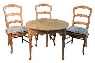 Four Piece French Set, to include a round table and three rush seat chairs, height 27 inches, diameter 34 inches.