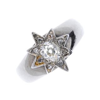 A diamond dress ring. The old-cut diamond, within a rose-cut diamond star-shape surround, set atop a
