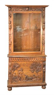 Continental Walnut Cabinet, in two parts having carved putti figures and hunting scene on ball feet, height 87 inches, width 41 1/2 inches, depth 15 1