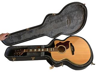 Takamine Acoustic Guitar, serial number EG523SG, G-Series, flame maple top, acoustic/electric pickup with hardshell case.