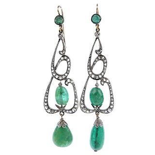A pair of emerald and diamond ear pendants. Each designed as an emerald bead drop, suspended from a
