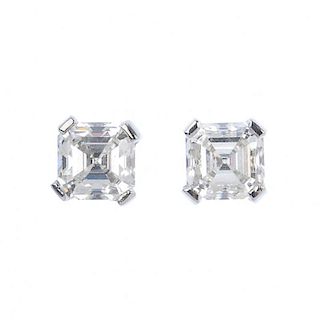 A pair of platinum square-shape diamond ear studs. Accompanied by mini report number 20025968, from