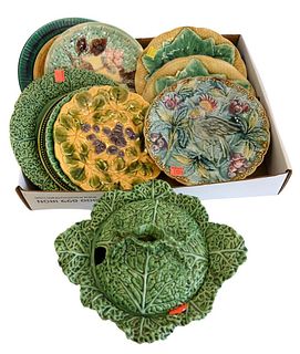 Group of Majolica Plates, to include a set of four, one with a bird, cabbage covered serving dish, etc., largest diameter 10 inches.