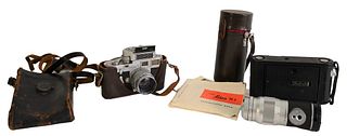 Leica M3 Camera, having Leica Elmar 1:4/135 mm and telescoping lens, some original Leica booklets along with Kodak box camera. Provenance: The Estate 