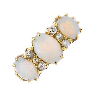 An Edwardian 18ct gold opal and diamond ring. The slightly graduated oval- opal cabochons, with old-