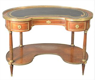 Louis XVI Style Kidney Shaped Mahogany Writing Table, having ormolu mounts throughout, a leather writing surface, and three drawers, all over tapering