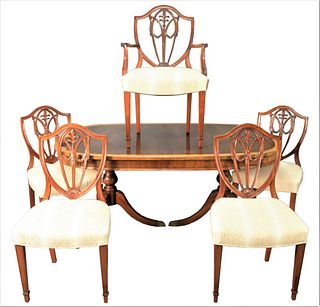 Mahogany Seven Piece Dining Set, having banded inlaid double pedestal dining table with three leaves along with six shield back chairs.