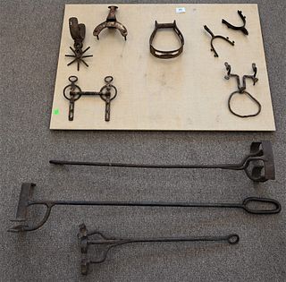 Group of Iron American Farming Implements, to include three branding tools, a bridle, stirrup, spurs, along with a saddle horn.