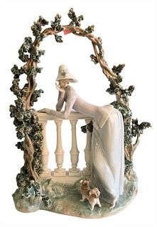 Large Lladro Porcelain Figure, having a figure leaning on a fence with a small dog, marked to the underside, height 19 1/2 inches, length 13 1/2 inche