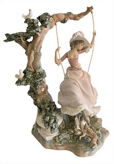 Large Porcelain Lladro Figure, "Victorian Girl on a Swing" by Salvador Debon, marked to the underside, overall height 13 1/2 inches.