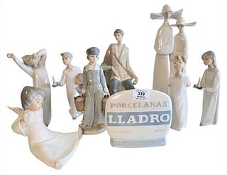 Eight Piece Lot of Porcelain Lladro Figures, to include several children in nightgowns, an angel, a shepherd (missing staph), a young boy carrying buc