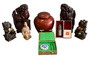 Eight Piece Chinese Lot, to include a pair of carved wooden foo dogs, a pair of soapstone foo dogs, terracotta kneeling army figure, wood painted lidd