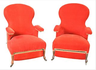 Pair of Victorian Upholstered Armchairs, having pull out ottomans, height 39 inches, width 26 inches.
