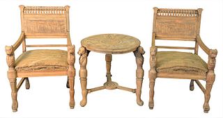 Four Piece Egyptian Revival Set, having two armchairs, loveseat, and round center table, all with cut hand rests and supports (in need of upholstery a