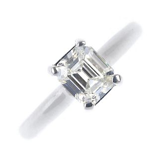 An 18ct gold diamond single-stone ring. The rectangular-shape diamond, to the plain band. Estimated