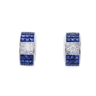 A pair of 18ct gold sapphire and diamond ear hoops. Each designed as two square-shape sapphire clust