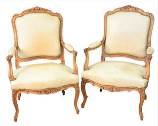 Pair of Louis XV Style Bergeres, having leather upholstery, height 41 inches, width 28 inches.