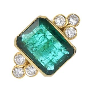 An 18ct gold emerald and diamond ring. The rectangular-shape emerald, with brilliant-cut diamond col