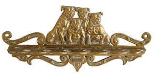 Brass Wall Mounted Pipe Holder, having four bulldogs over six pipe slots, length 12 1/2 inches.