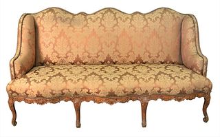 Louis XV Upholstered Sofa, having serpentine front and carved frame (legs repaired), height 41 1/2 inches, length 77 inches.