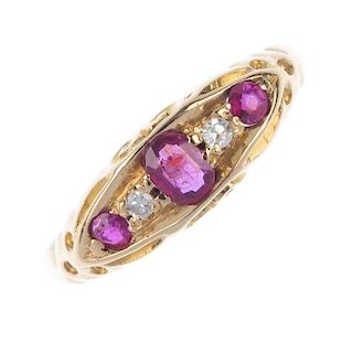 An early 20th century 18ct gold ruby and diamond five-stone ring. The three graduated oval and circu