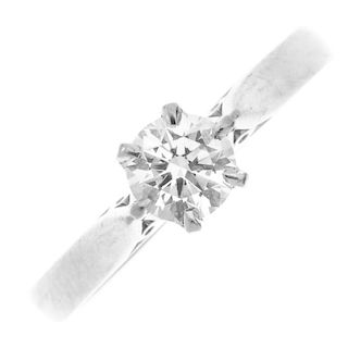 A platinum diamond single-stone ring. The brilliant-cut diamond, weighing 0.51ct, to the plain band.