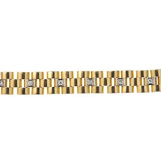An 18ct gold diamond bracelet. Designed as a series of brick-links, with brilliant-cut diamond highl