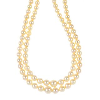 A cultured pearl two-row necklace. Comprising two-rows of seventy-two and seventy-seven graduated cu